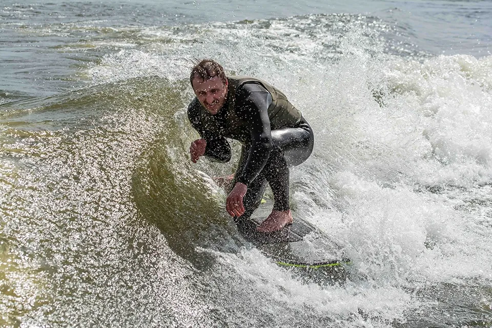 Wake surfer behind a Big Thunder Marine boat